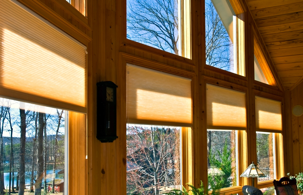 Large windows in a house showing the window treatments.